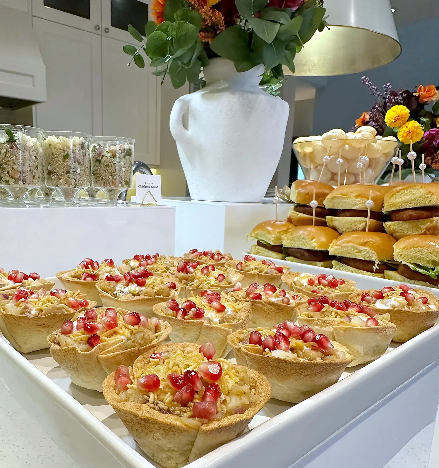 Katori chaat cups topped with pomegranate and sev on a styled display