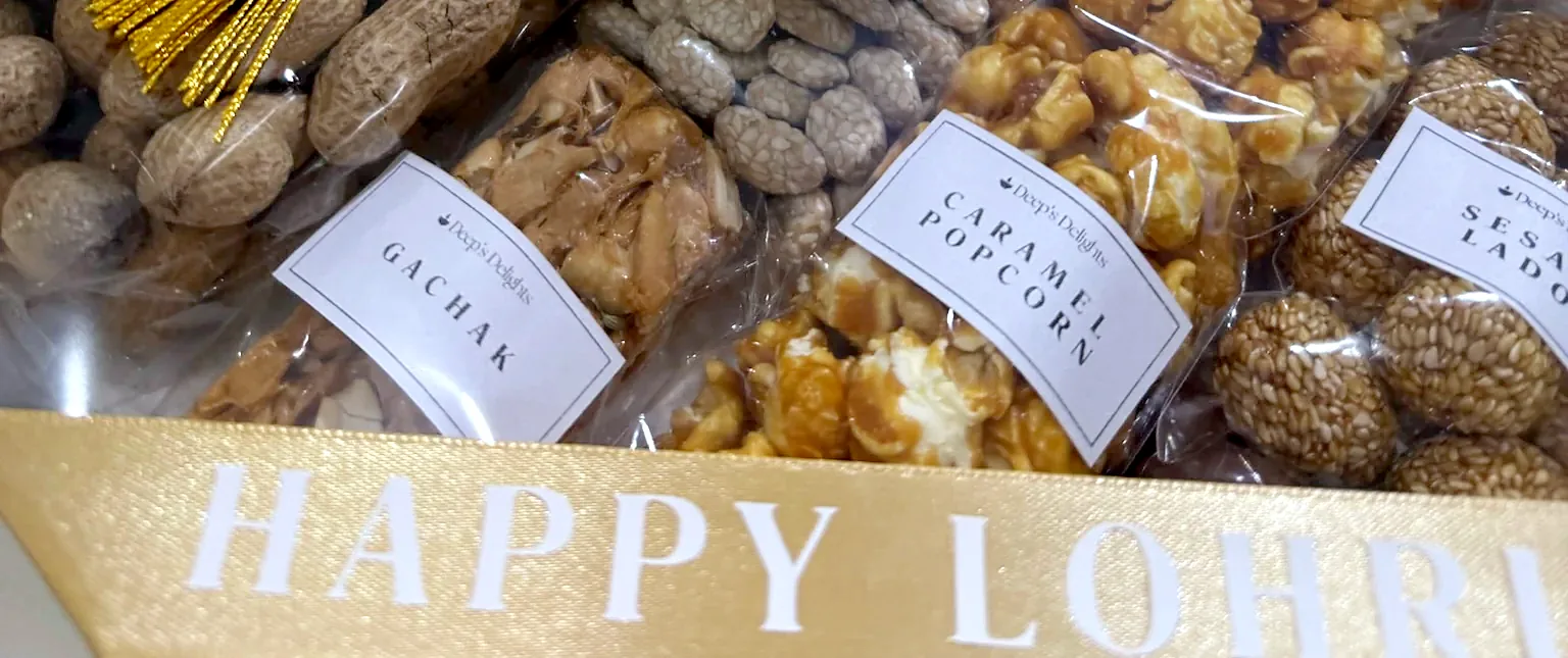 A Lohri treat box with gajak, caramel popcorn and sesame ladoo
