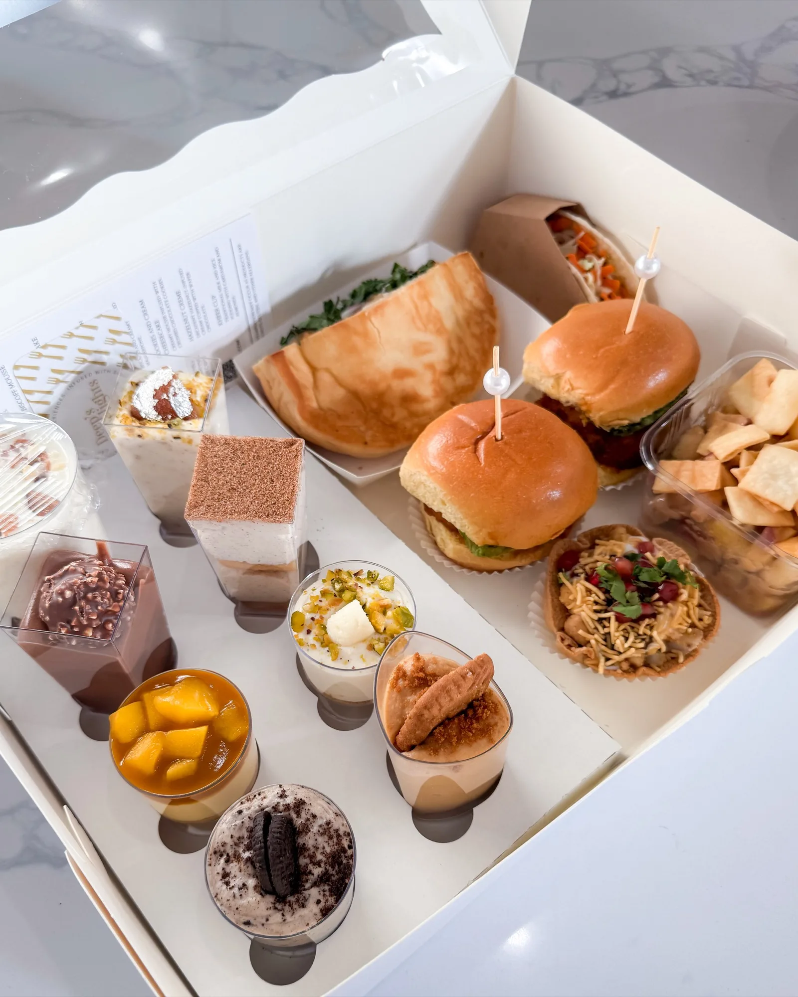 Deep's Delights Ultimate Tasting Box with 14 Indian fusion appetizers and desserts in Calgary